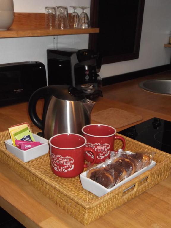 a counter with two cups and a tray of food at Tourny - Studio cosy Centre médiéval Sarlat in Sarlat-la-Canéda
