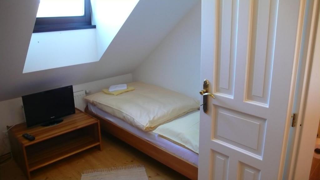 Postel nebo postele na pokoji v ubytování Penzion Fousek