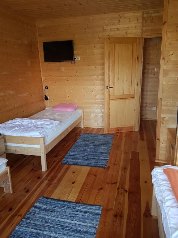Postel nebo postele na pokoji v ubytování Cztery Pory Roku