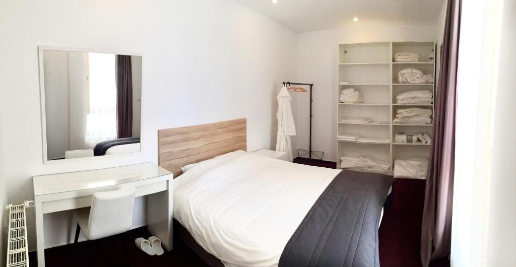 Ένα ή περισσότερα κρεβάτια σε δωμάτιο στο Vila Coquette