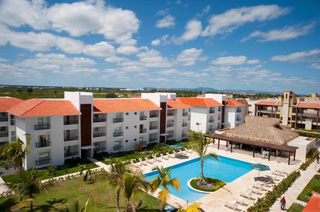 an aerial view of an apartment complex with a swimming pool at Karibo Punta Cana in Punta Cana