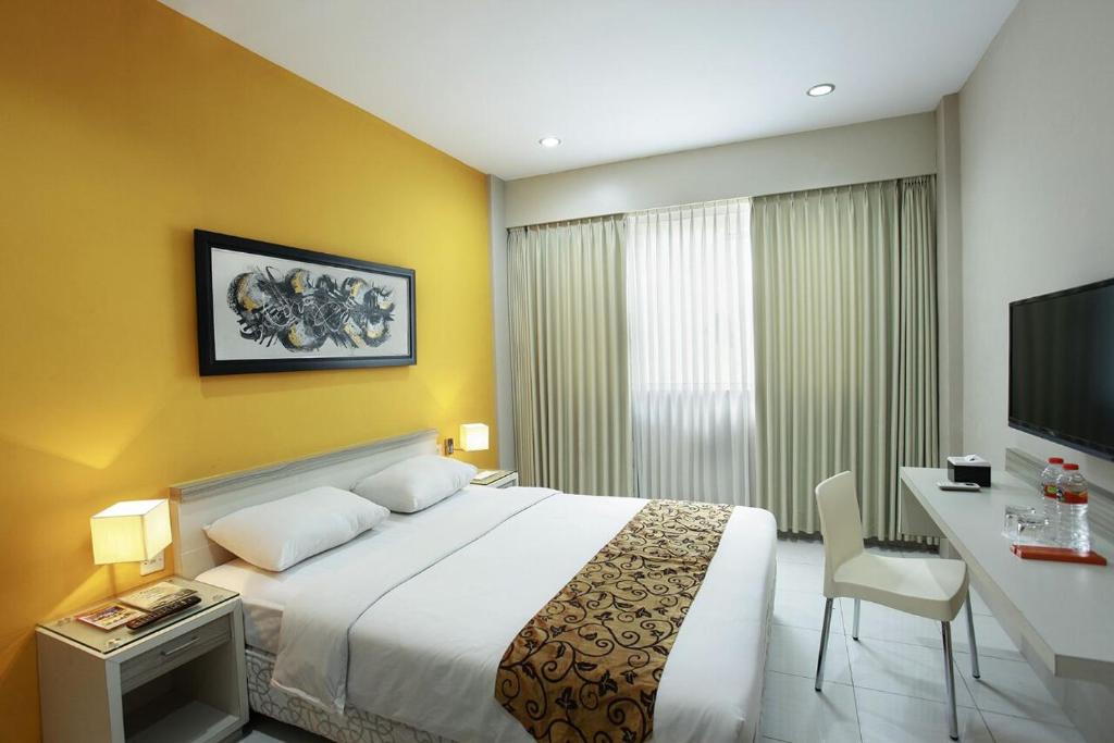 Postel nebo postele na pokoji v ubytování Rivisha Hotel