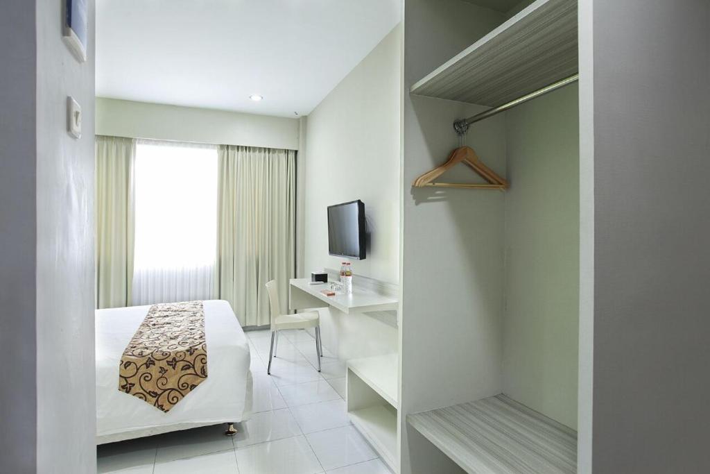 TV a/nebo společenská místnost v ubytování Rivisha Hotel