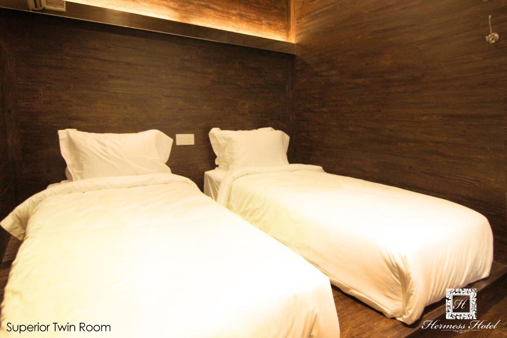 Postel nebo postele na pokoji v ubytování Hermess Hotel Johor