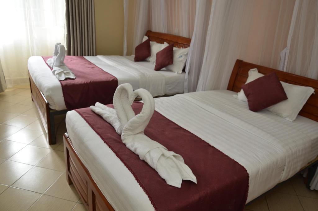 Postel nebo postele na pokoji v ubytování Decasa Hotel