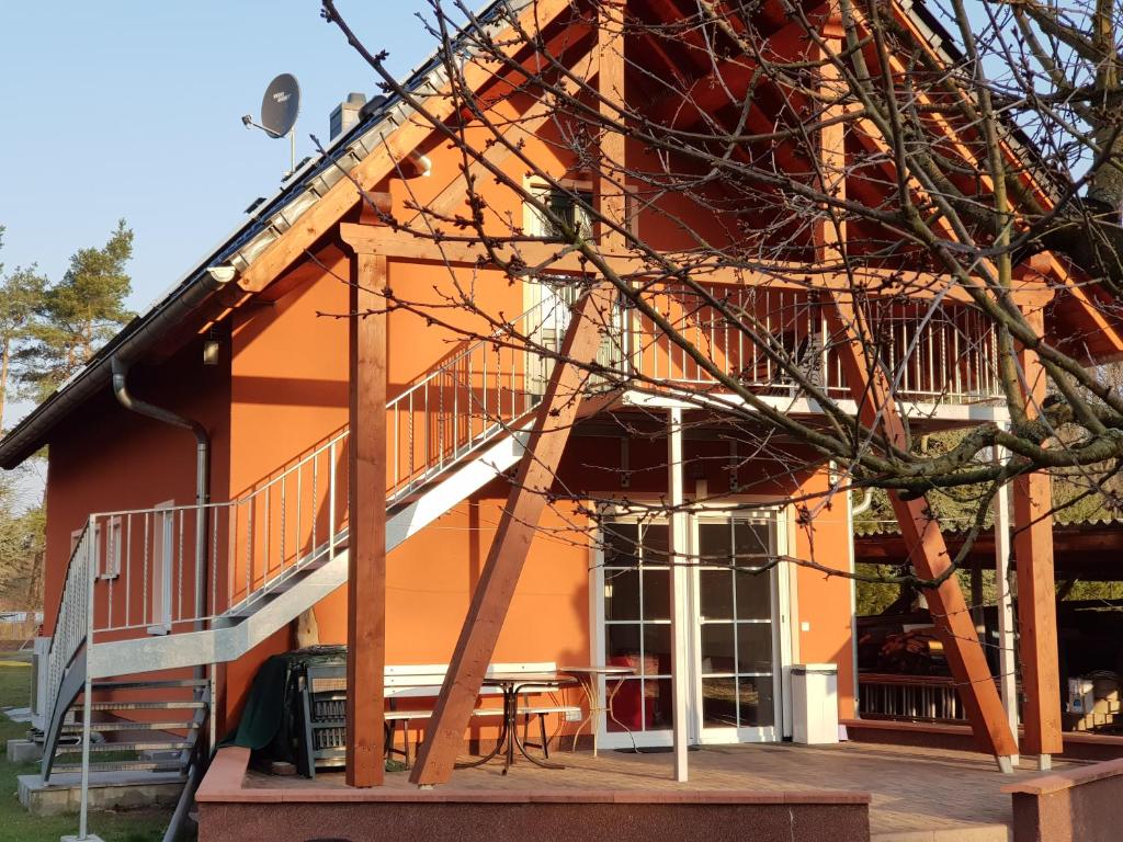 a building with a staircase in front of it at NR- Fewo mit Ladestation für E-Autos in Melchow