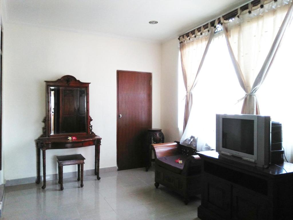 TV a/nebo společenská místnost v ubytování Nuriani Guest House