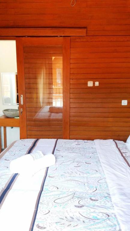 Postel nebo postele na pokoji v ubytování Gili Desa