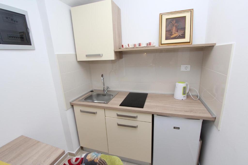 Kuchnia lub aneks kuchenny w obiekcie Apartments Sorriso