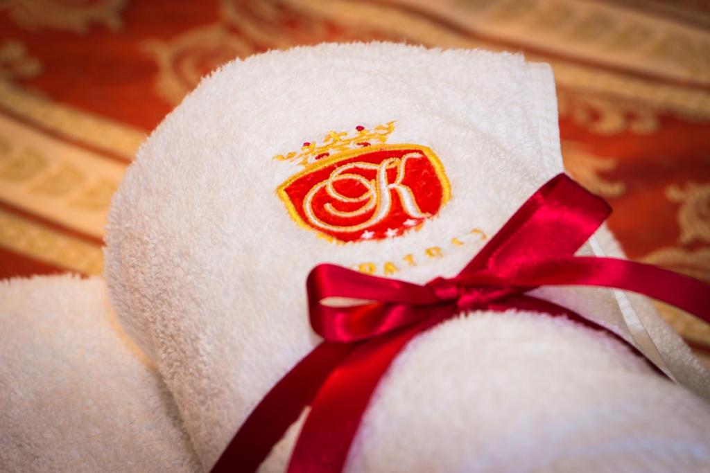 a close up of a towel with a red bow at Hotel U Krále in Jičín