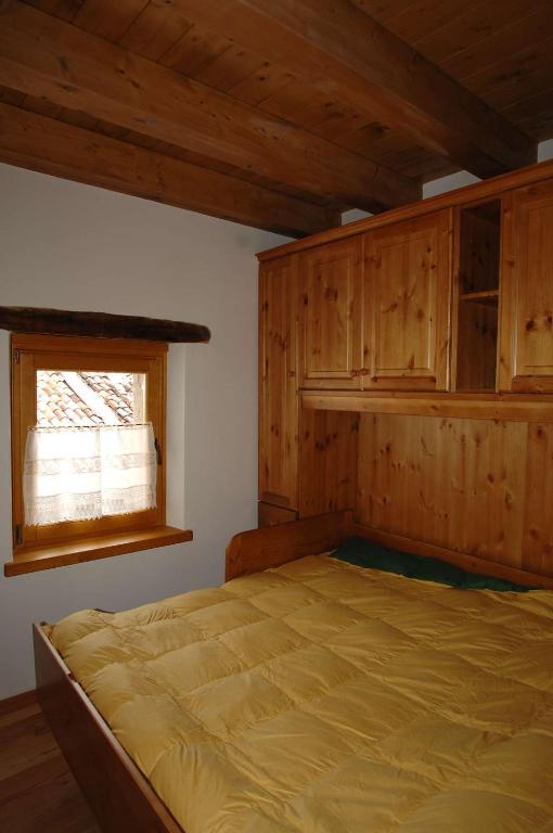 Postel nebo postele na pokoji v ubytování Albergo Diffuso Valcellina e Val Vajont in Erto