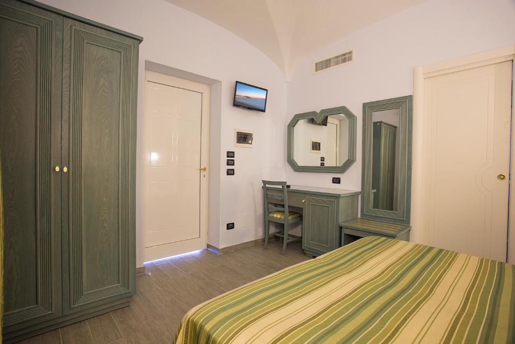 Postel nebo postele na pokoji v ubytování Hotel Terme Saint Raphael