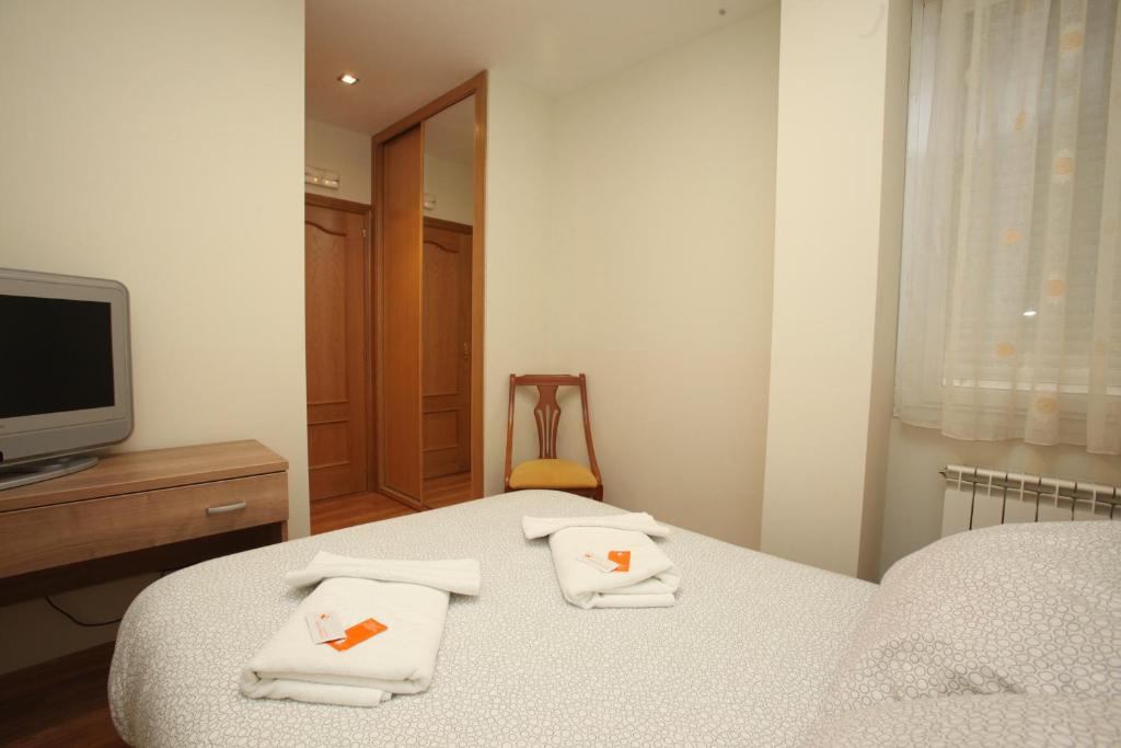 Posteľ alebo postele v izbe v ubytovaní Hostal Restaurante Central