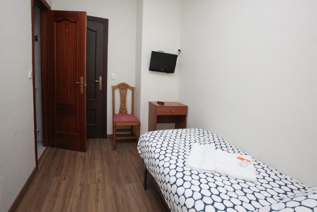 Posteľ alebo postele v izbe v ubytovaní Hostal Restaurante Central