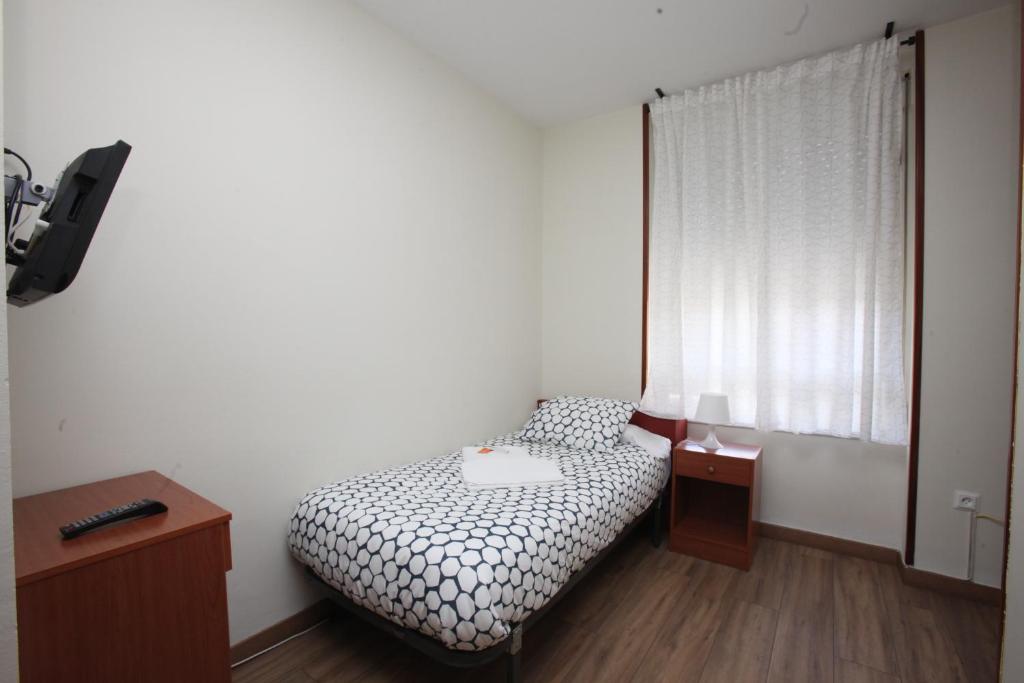 Posteľ alebo postele v izbe v ubytovaní Hostal Restaurante Central