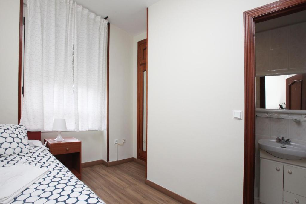 Posteľ alebo postele v izbe v ubytovaní Hostal Restaurante Central
