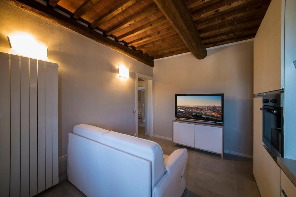 TV a/nebo společenská místnost v ubytování Rocca Palazzaccio