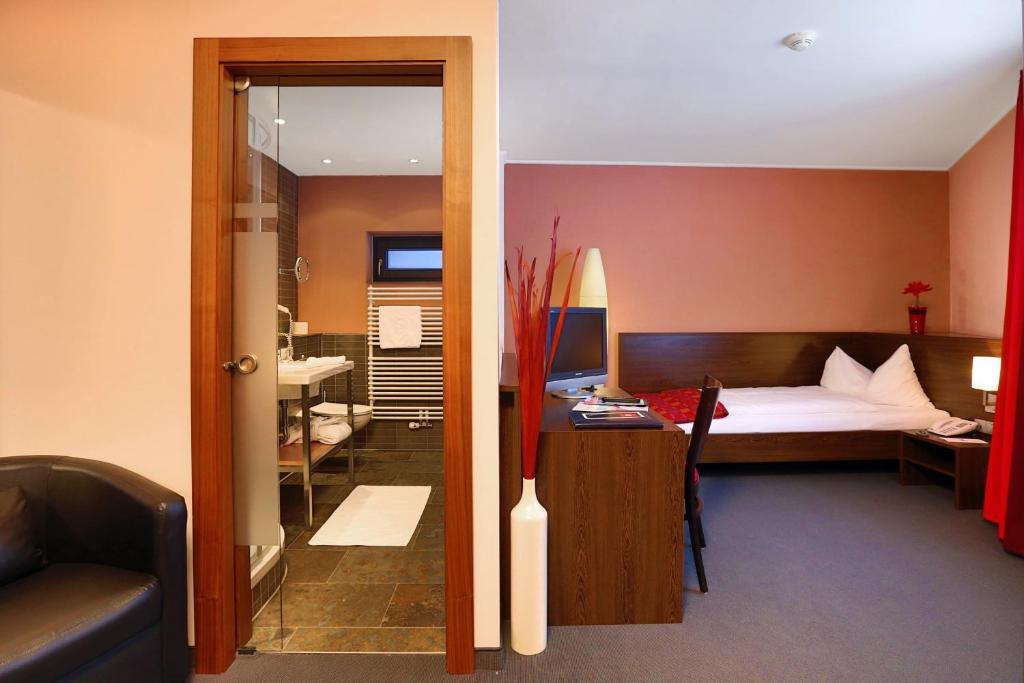 Кровать или кровати в номере Josl Mountain Lounging Hotel - Adults only!