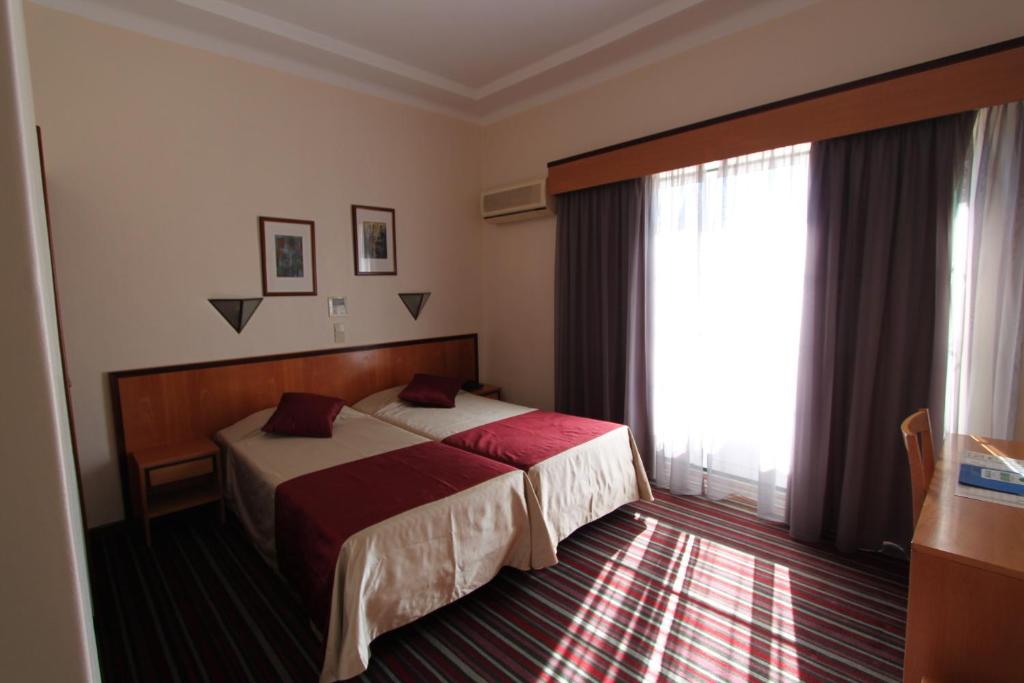 Postel nebo postele na pokoji v ubytování Residencial Horizonte