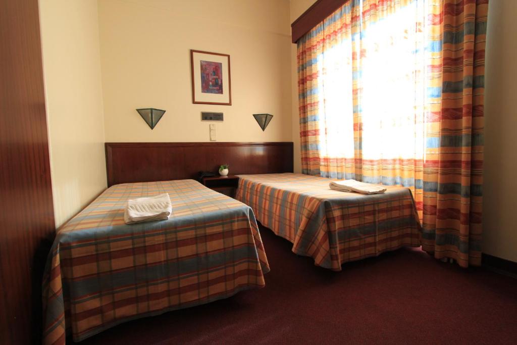 Postel nebo postele na pokoji v ubytování Residencial Horizonte