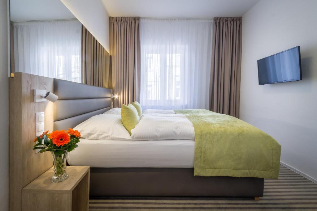 Ένα ή περισσότερα κρεβάτια σε δωμάτιο στο Hotel White Lion