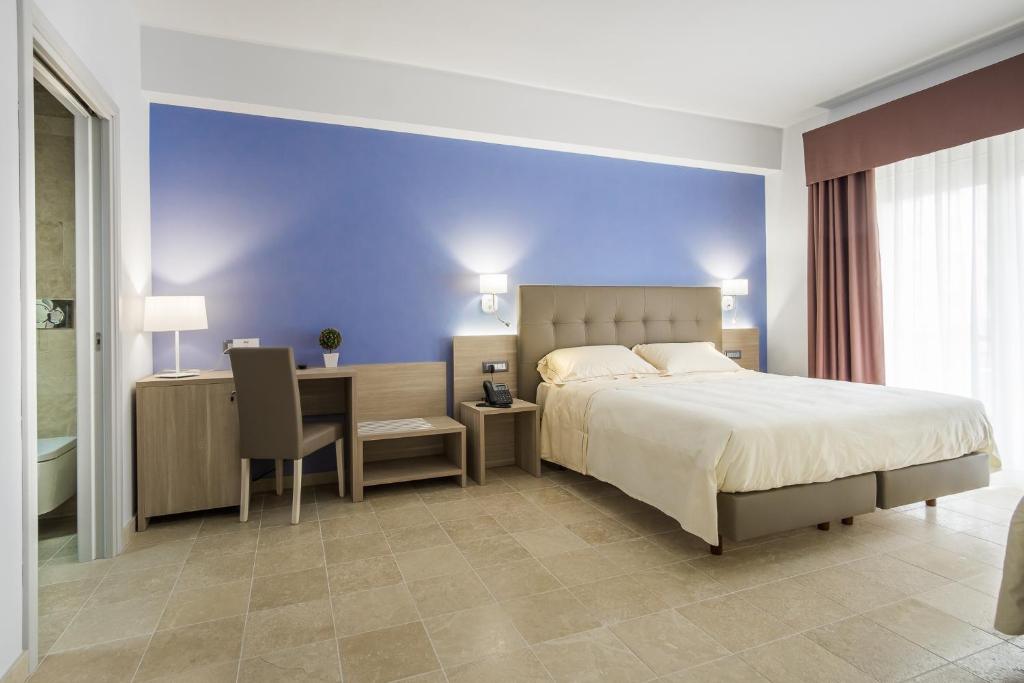 Postel nebo postele na pokoji v ubytování Netum Hotel