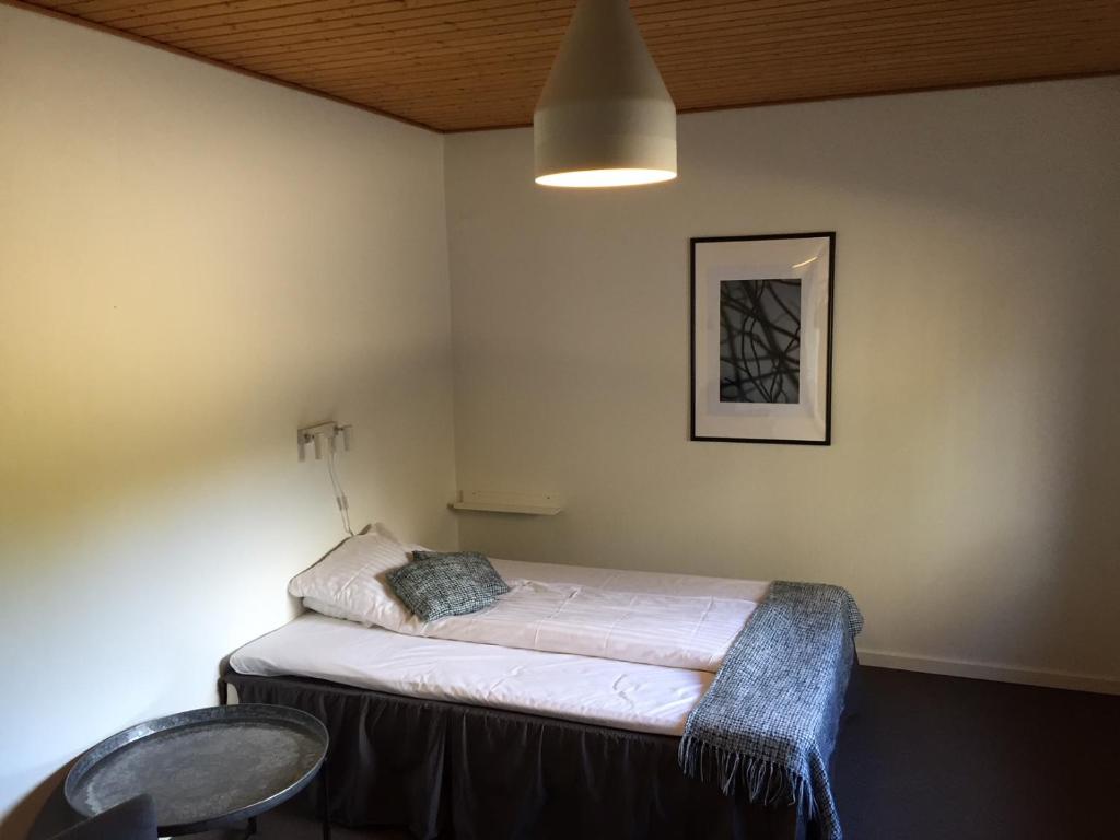 Postel nebo postele na pokoji v ubytování Dalby Hotel