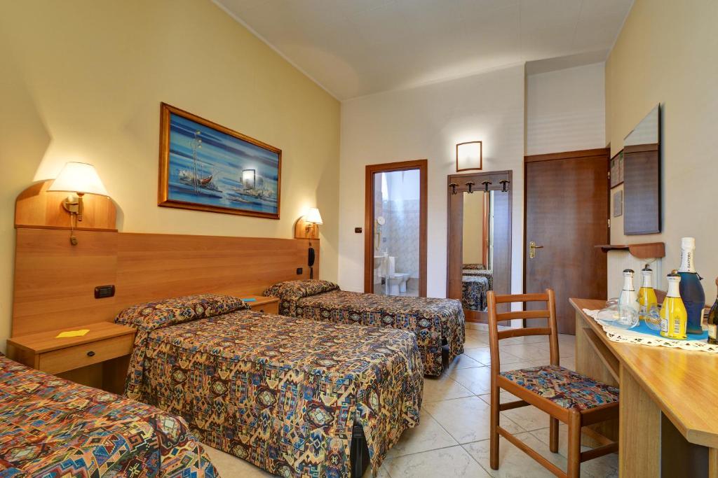 Postel nebo postele na pokoji v ubytování Hotel Eden