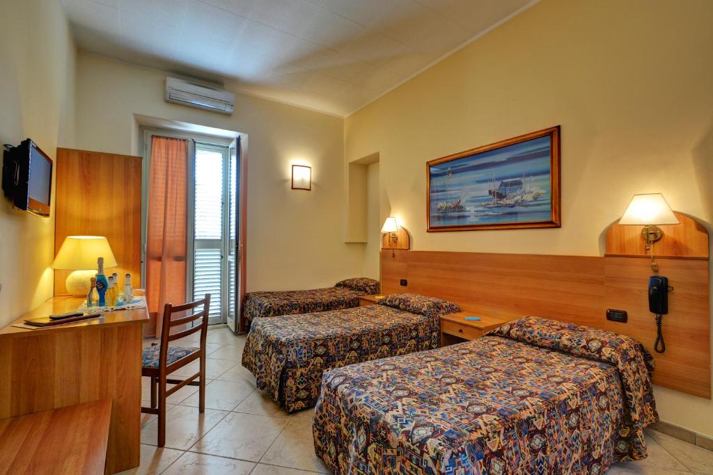 Postel nebo postele na pokoji v ubytování Hotel Eden