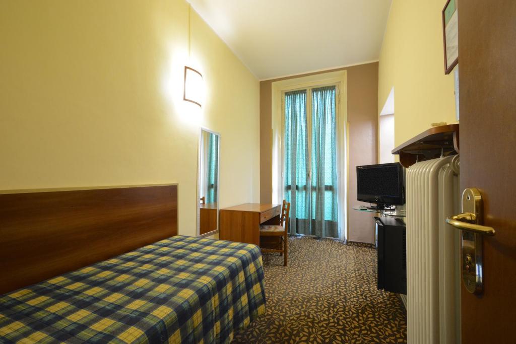 Postel nebo postele na pokoji v ubytování Hotel Eden