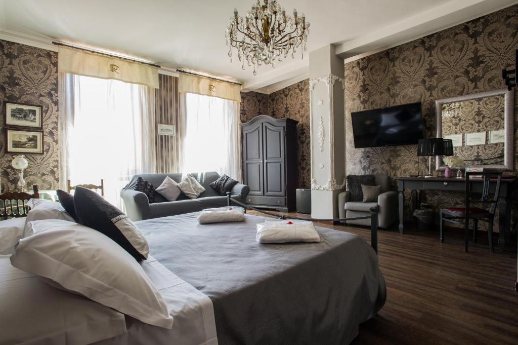 a bedroom with a bed with two pillows on it at Hotel Residenza In Farnese in Rome