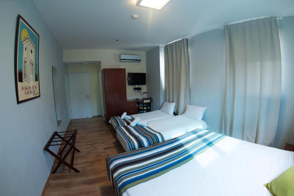 Postel nebo postele na pokoji v ubytování Villa Nazareth B&B