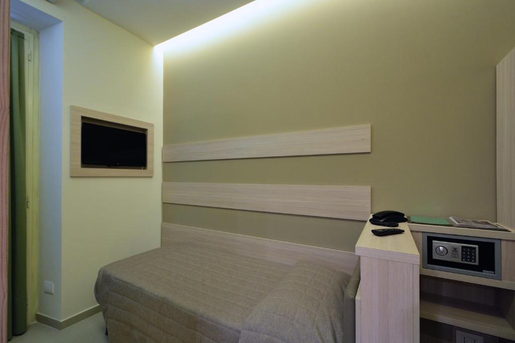 Postel nebo postele na pokoji v ubytování Hotel Eden