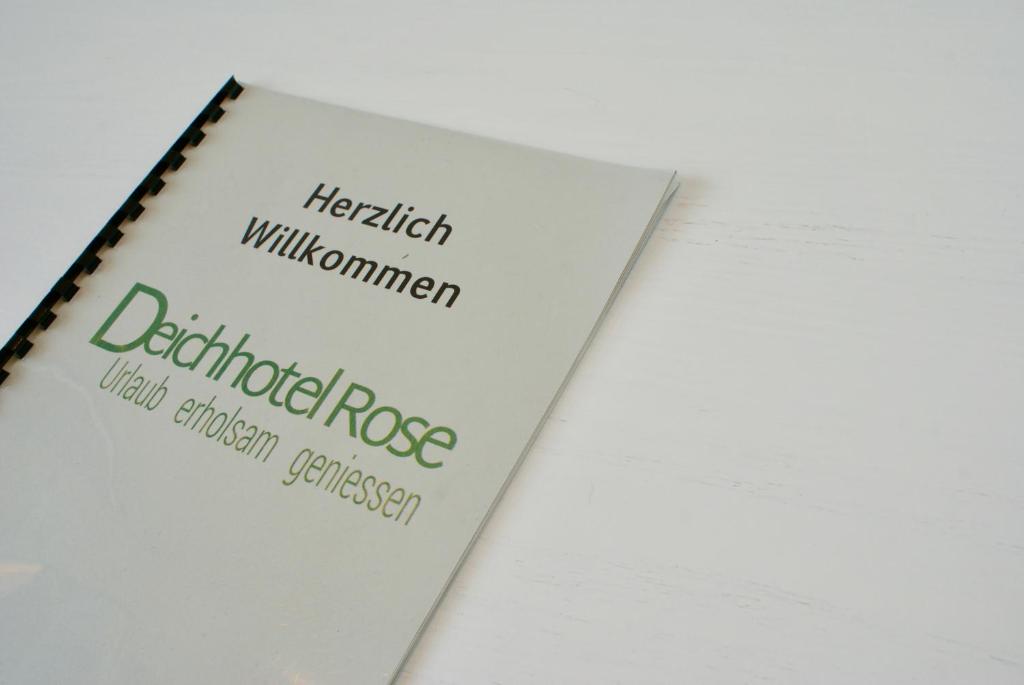 a book with the words harrit williamsworth and dartfordrosis on it at Deichhotel Rose in Juist