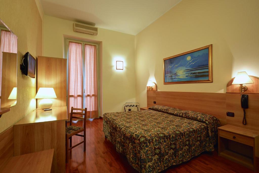 Postel nebo postele na pokoji v ubytování Hotel Eden