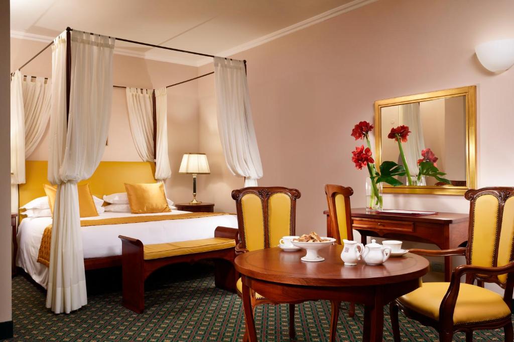 Postel nebo postele na pokoji v ubytování Hotel Berchielli