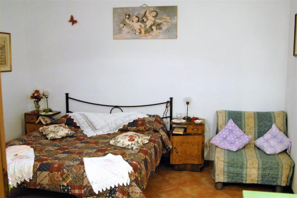Postel nebo postele na pokoji v ubytování La Capannella