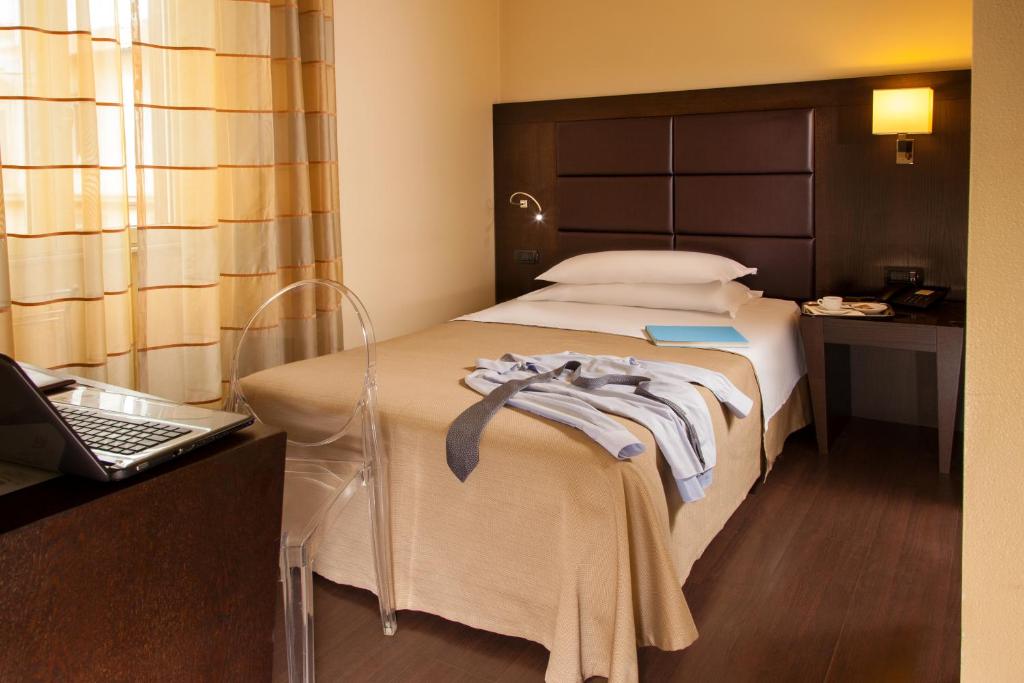 Postel nebo postele na pokoji v ubytování Hotel Buenos Aires