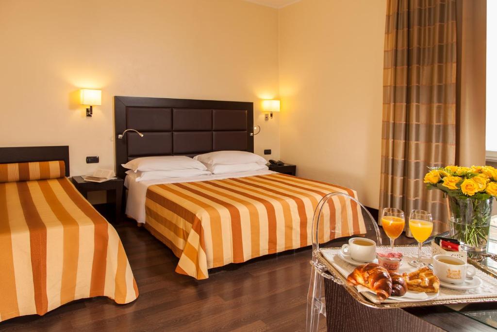 Postel nebo postele na pokoji v ubytování Hotel Buenos Aires