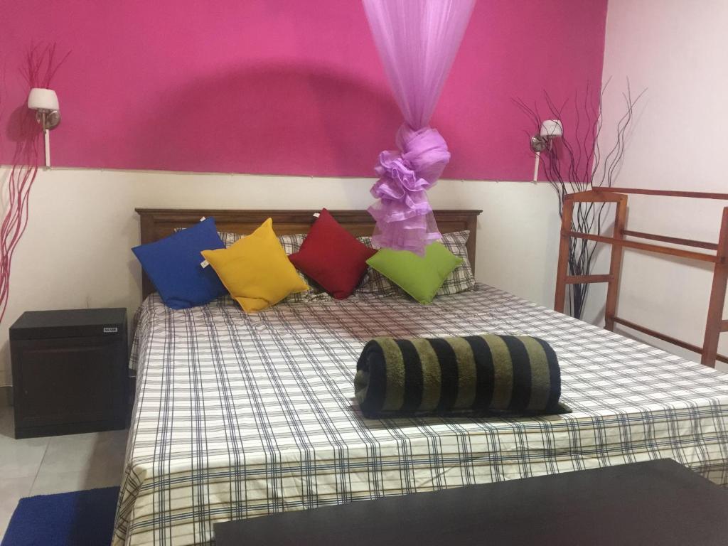 Postel nebo postele na pokoji v ubytování orchid villa