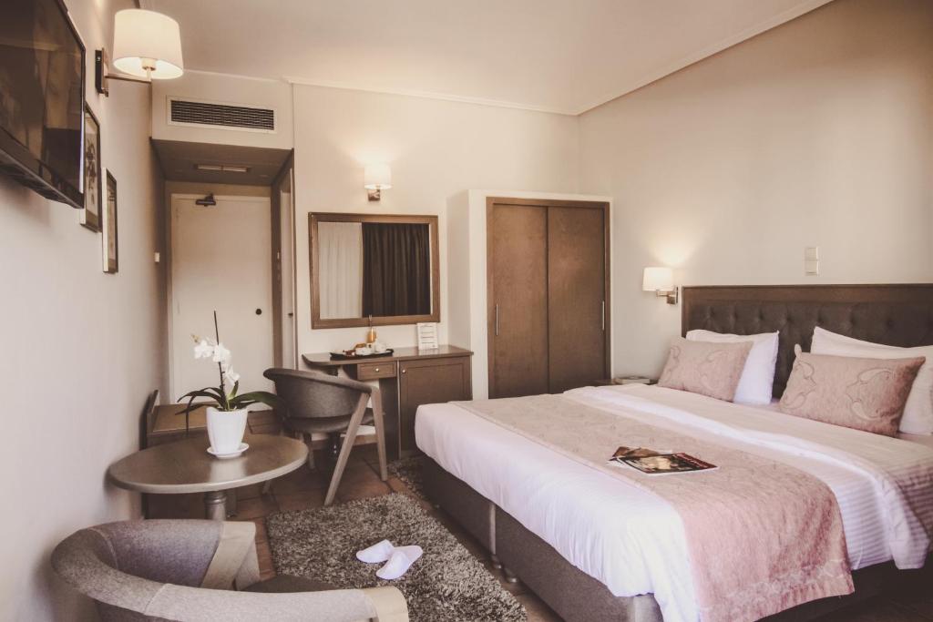 Postel nebo postele na pokoji v ubytování Green Hill Hotel