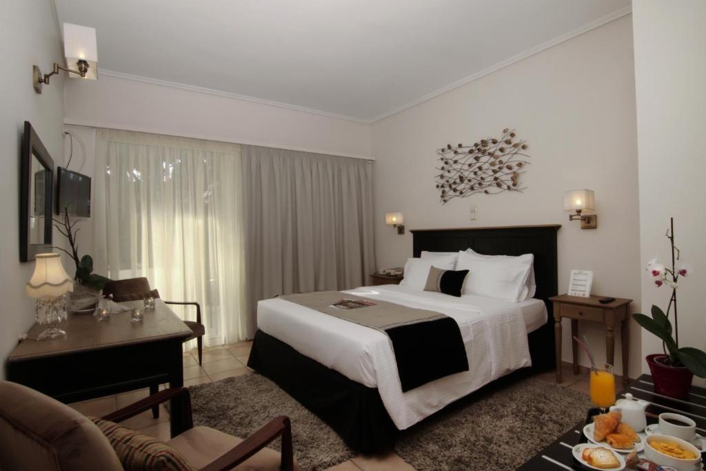 Postel nebo postele na pokoji v ubytování Green Hill Hotel