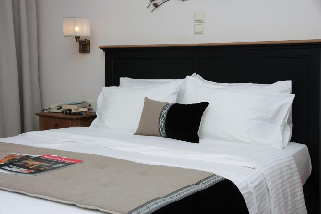 Postel nebo postele na pokoji v ubytování Green Hill Hotel