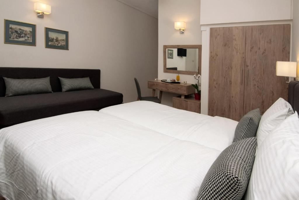 Postel nebo postele na pokoji v ubytování Green Hill Hotel