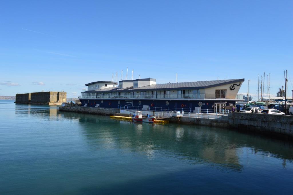 a large building sitting next to a body of water at Crabbers' Wharf in Portland