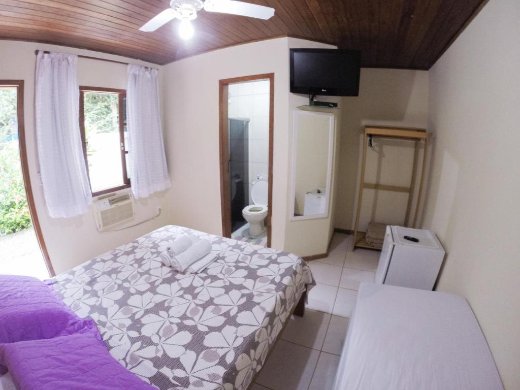 Postel nebo postele na pokoji v ubytování Pousada Recanto do Sabiá