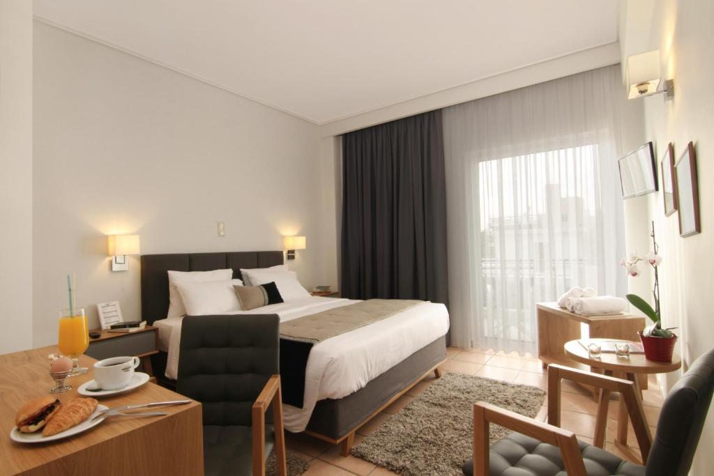 Postel nebo postele na pokoji v ubytování Green Hill Hotel