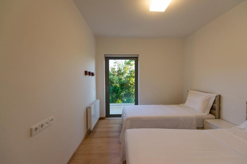 Postel nebo postele na pokoji v ubytování Villa Gonia