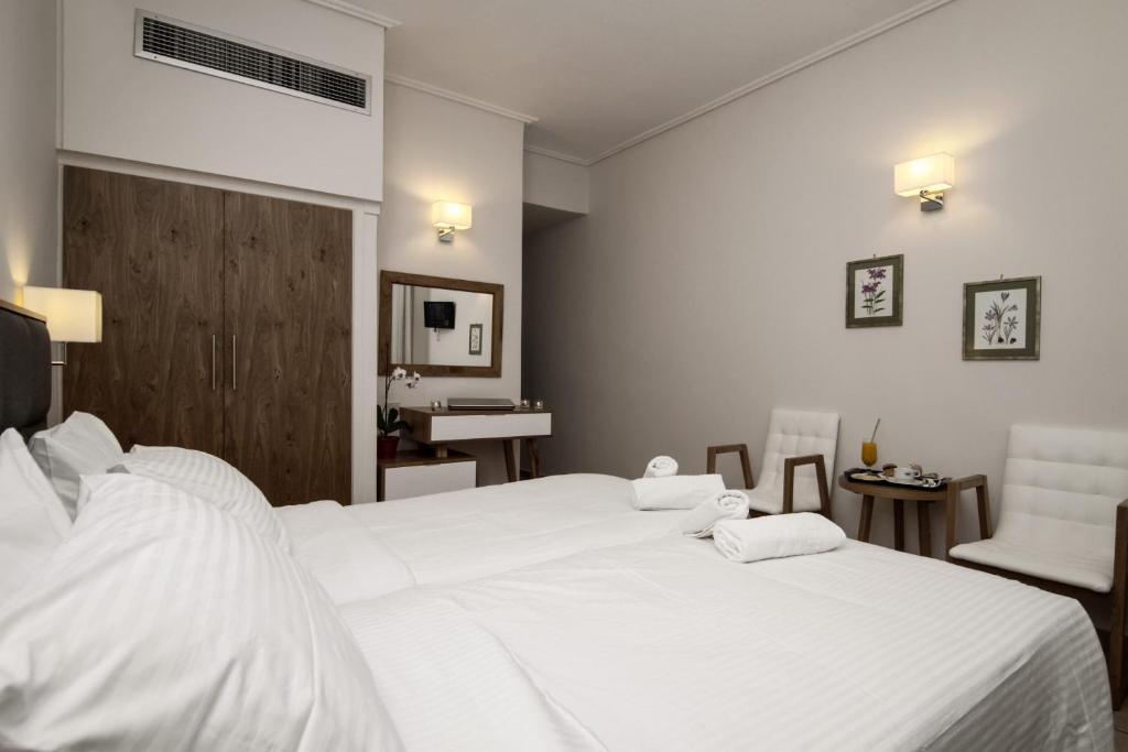 Postel nebo postele na pokoji v ubytování Green Hill Hotel