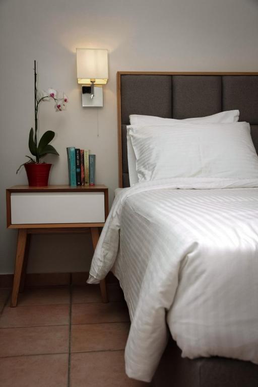 Postel nebo postele na pokoji v ubytování Green Hill Hotel